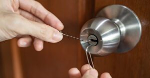 Applying graphite lubricant to a door lock for smoother operation and long-lasting performance